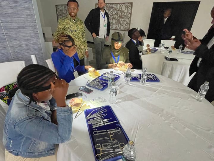 Participants practising with training materials around a table