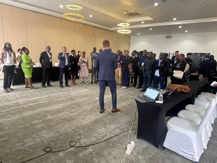 Participants standing in a circle during a congress session